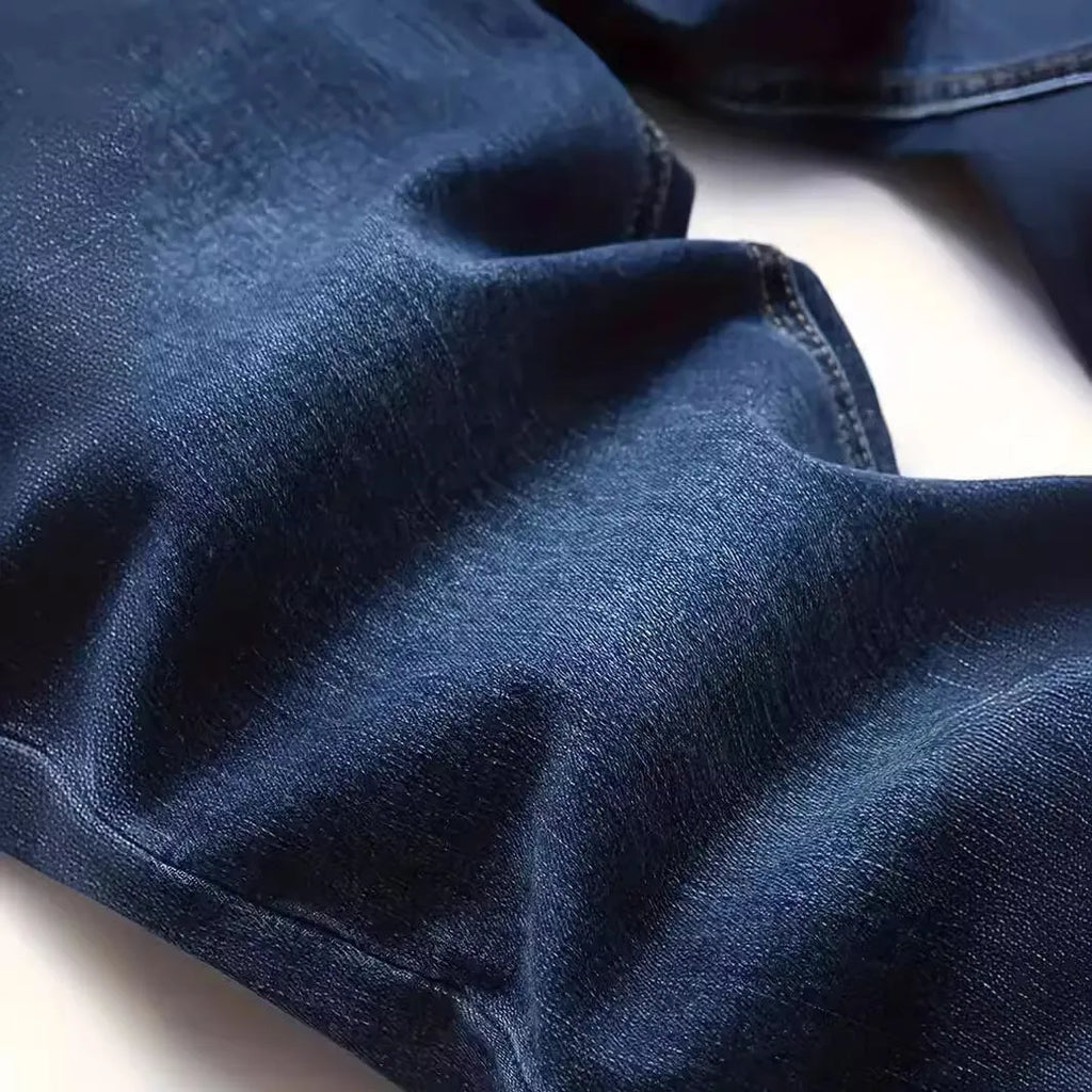 Men's dark blue slim-fit skinny casual jeans on a neutral background