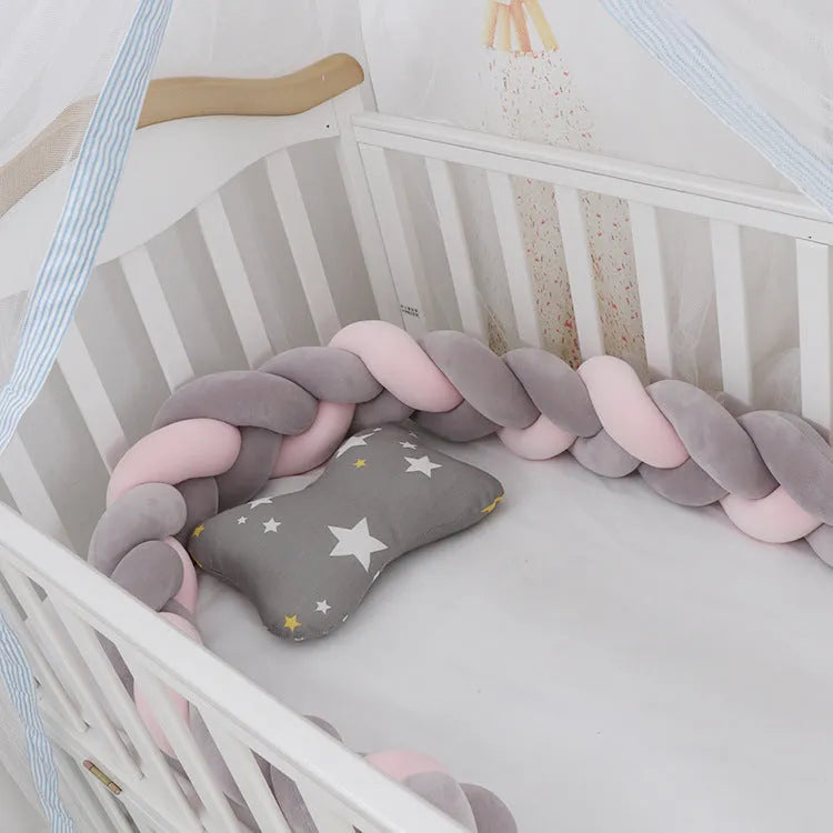 Soft spandex velvet baby crib bumper protector shown in a light grey colour, shaped around white crib bars.