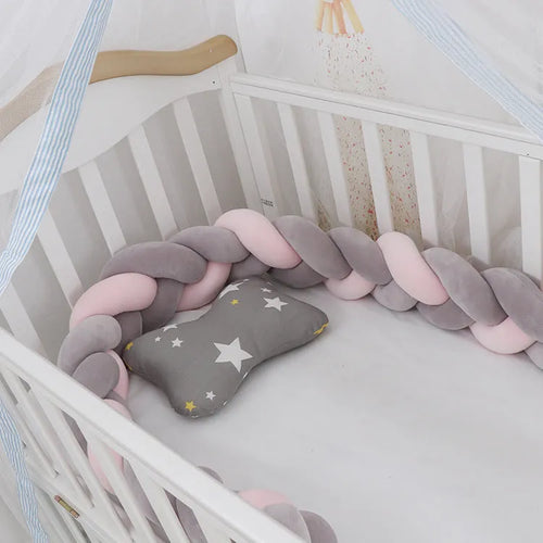 Soft spandex velvet baby crib bumper protector shown in a light grey colour, shaped around white crib bars.