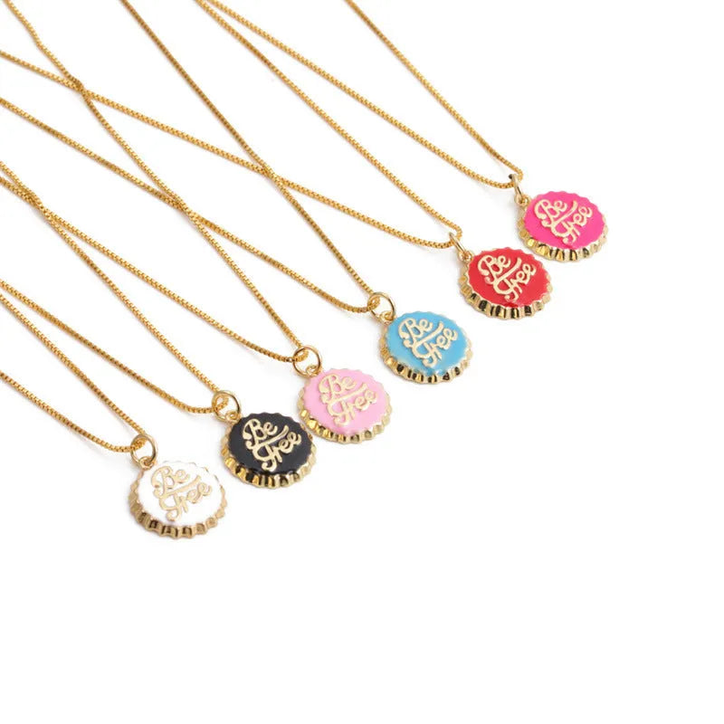 Copper bottle cap pendant necklace with gold electroplating on a box chain, shown in multiple colour options.