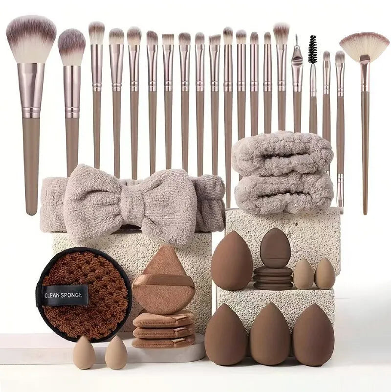 Beauty tool combination set with multiple pieces in pink, brown and purple colours for face wash and makeup application
