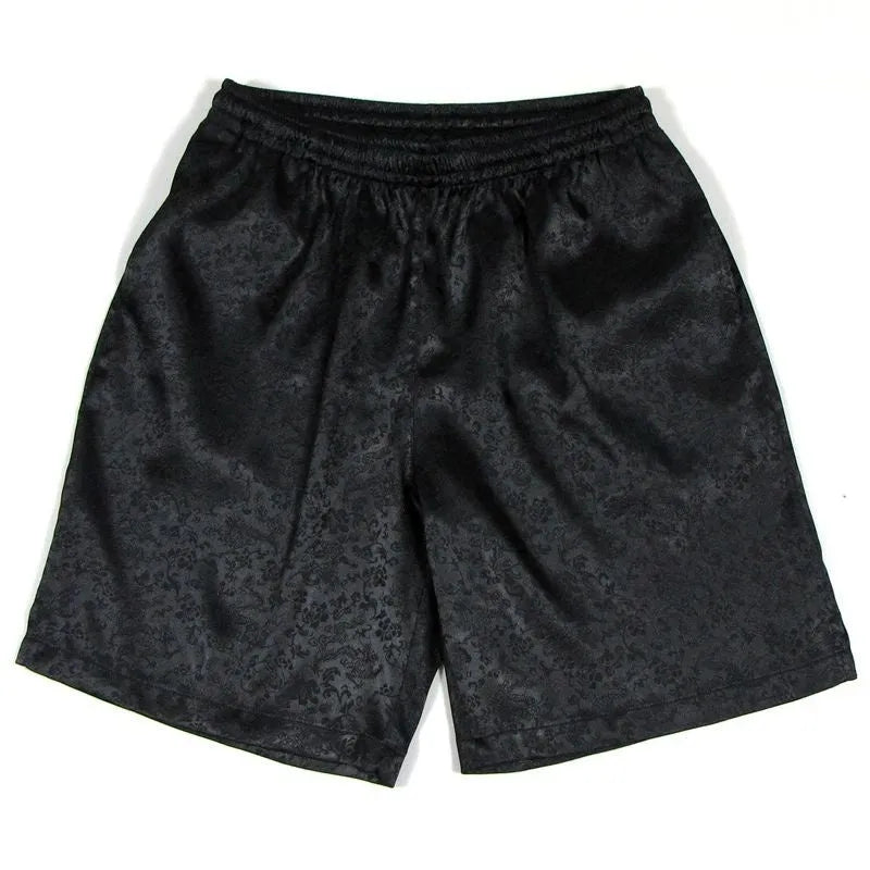 Men's black elastic drawstring Tai Chi shorts made from lightweight polyester fabric.