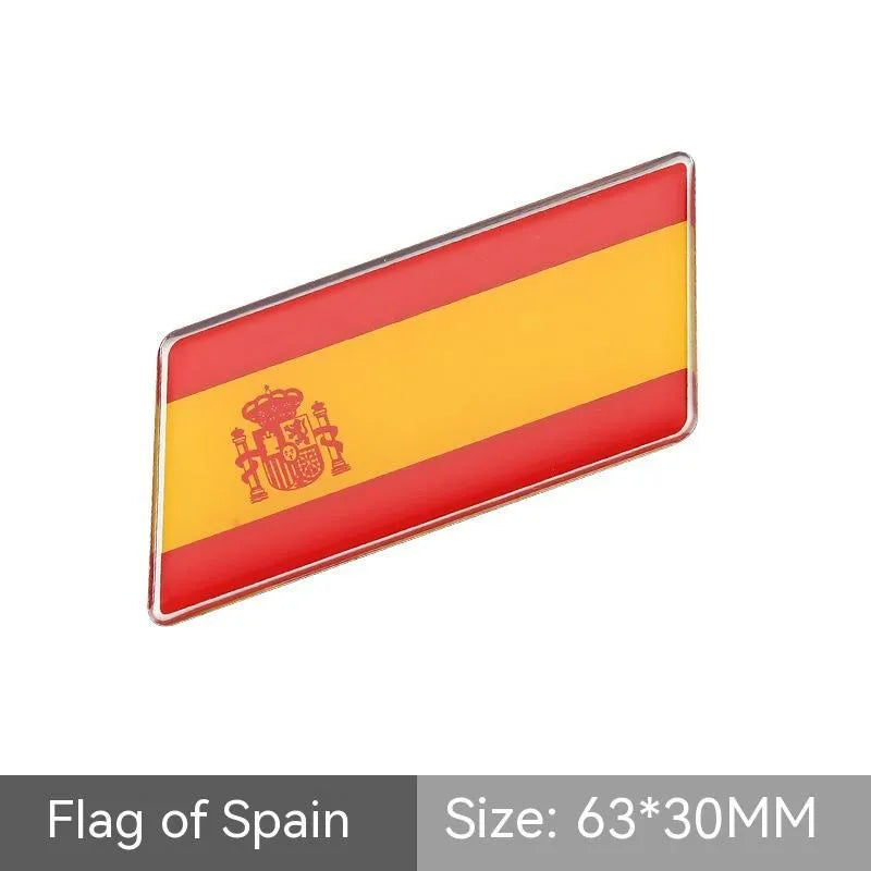 Aluminium metal car sticker with national flag design in a parallelogram shape.