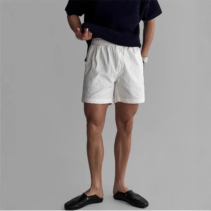 Cotton sports shorts in loose fitting design available in black, white and khaki colours