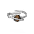 Women's adjustable open ring with Saturn design and tigereye styling in white gold electroplated silver