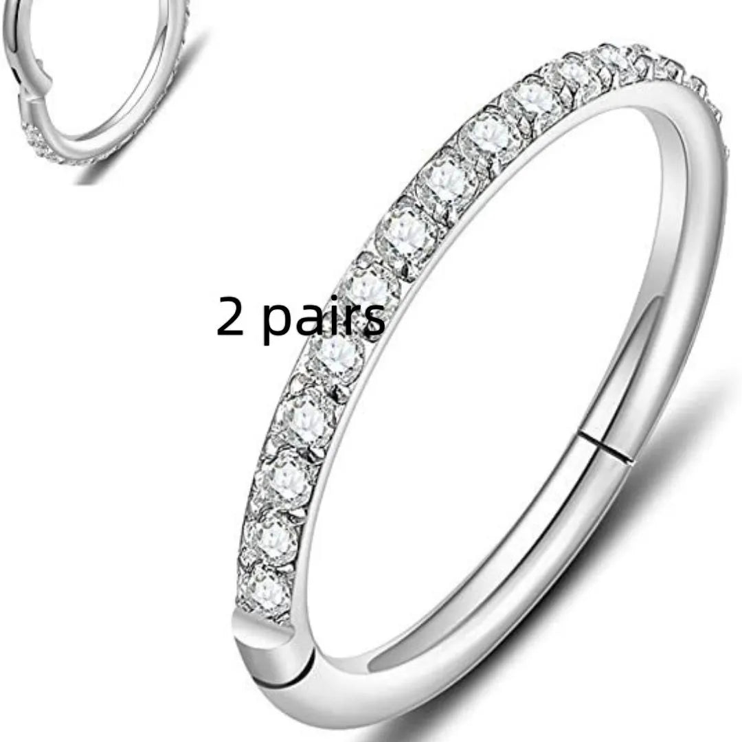 Stainless steel seamless nose rings showing steel, gold, rose gold, and black electroplated finishes with round design