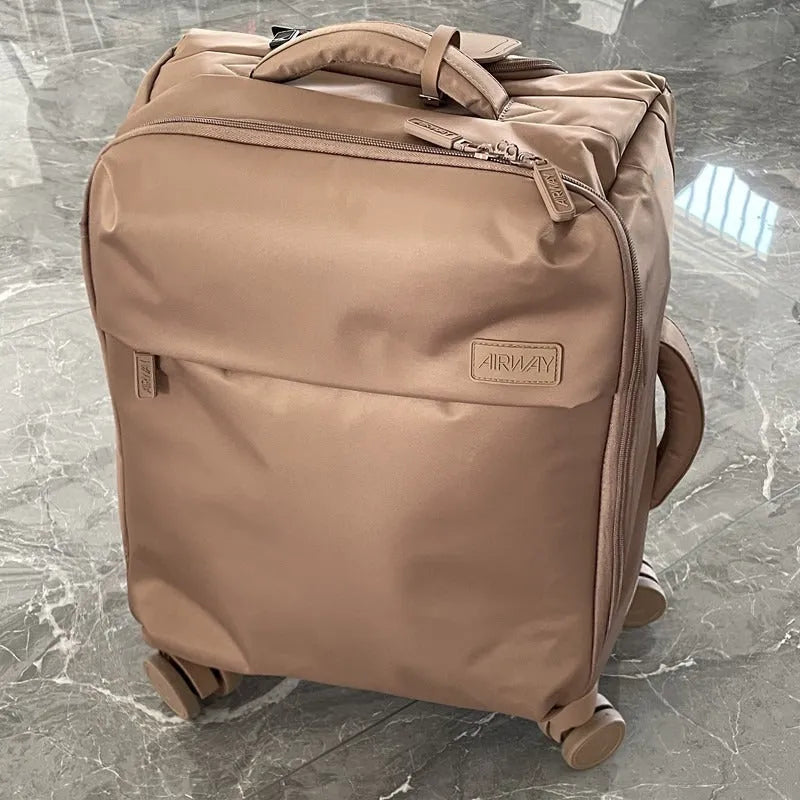 Ultra-light waterproof Oxford cloth suitcase with universal wheels in a bluestone green colour.