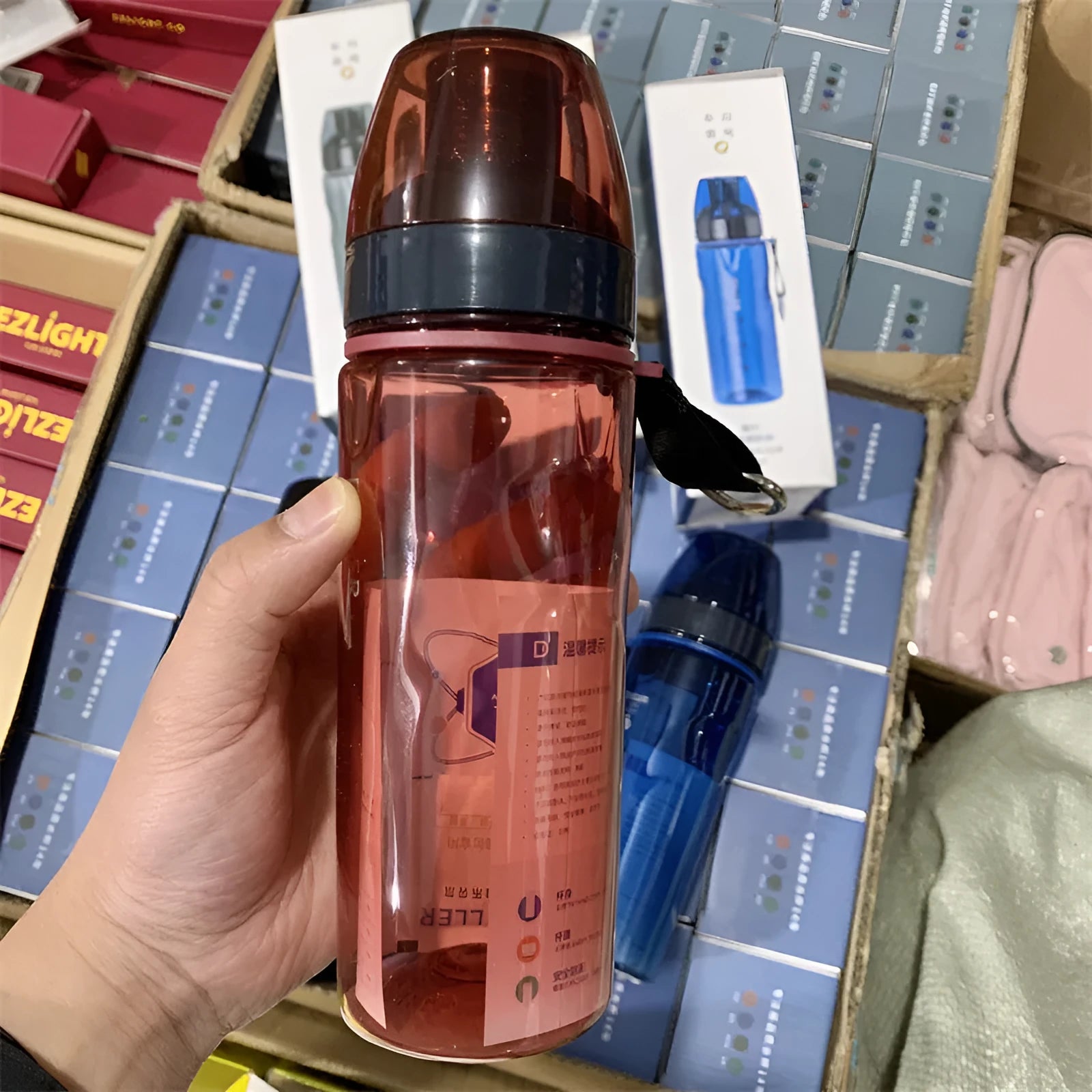 Chinese style sports water bottle with removable tea infuser compartment in blue, red, black or grey.