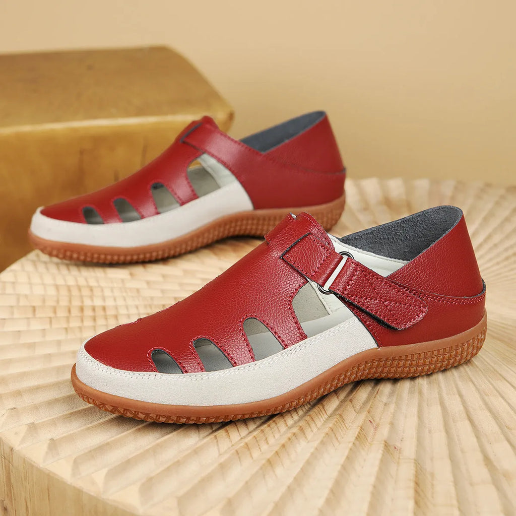 Women's plus size flat sandals in blue with hollow toe cap and breathable design on a thick rubber sole.