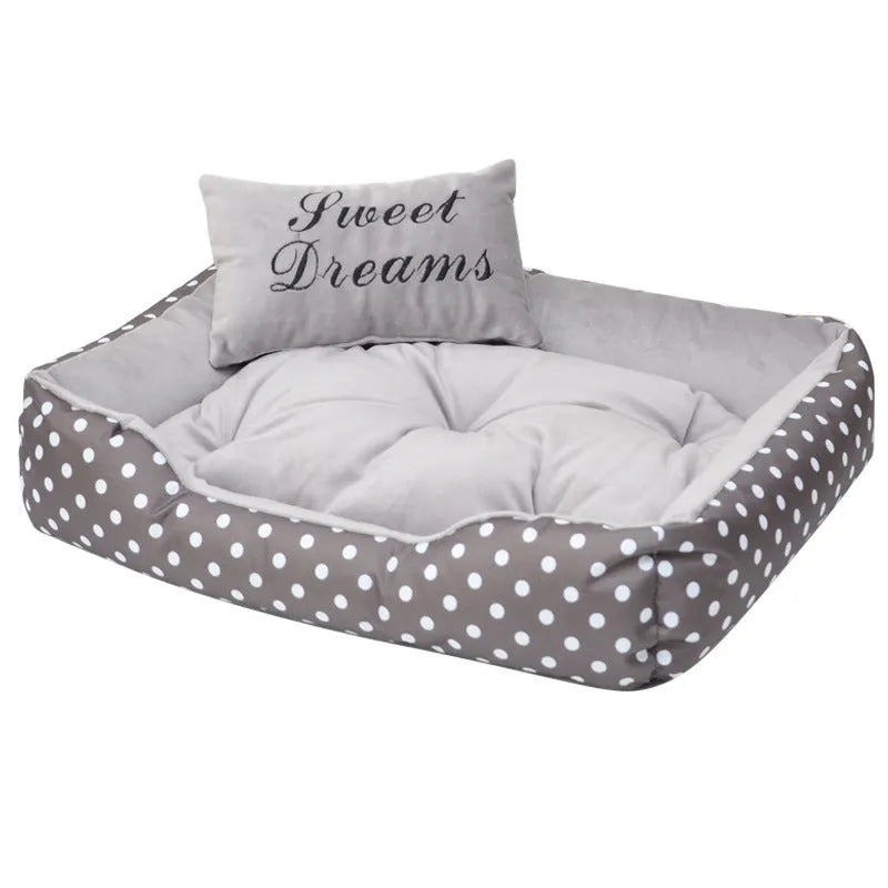 Polka dot print square dog bed with raised sides and a matching embroidered pillow in grey.
