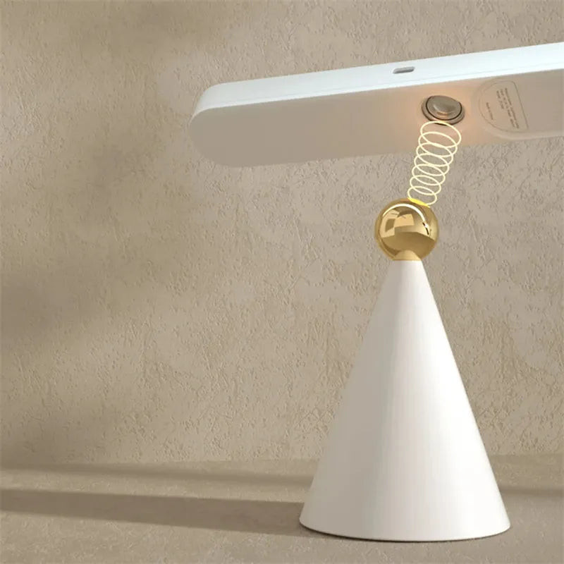 Geometric desk lamp with magnetic base in white or khaki colour