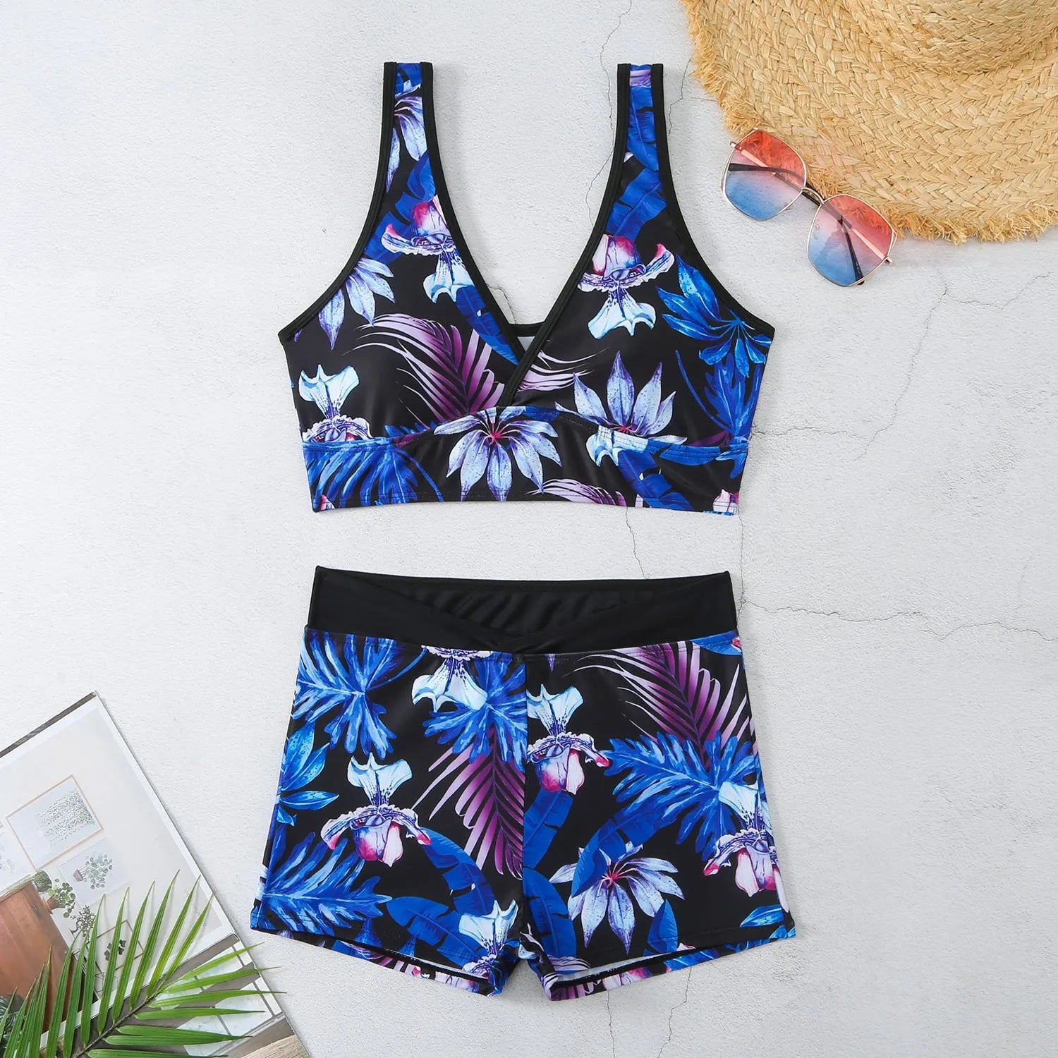 Women's two-piece swimsuit set with sleeveless top and printed boxer-style briefs in multiple colours.
