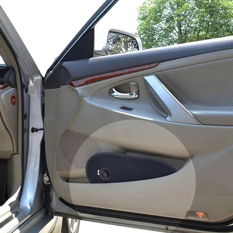 Black breathable car window shades stretched across a car side window with suction cup attachments
