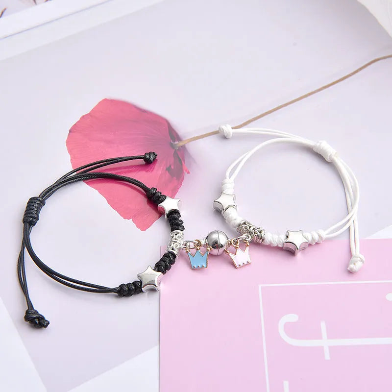 Magnetic couple bracelets with crown and diamond designs in alloy electroplated construction
