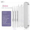 Four silver metal acne needles with pointed tips for skincare extraction.