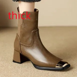 Brown women's Martin heeled leather boots with side zipper and metal rivet details.