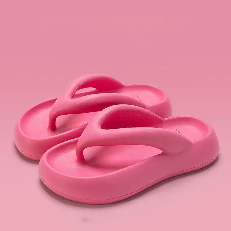 Solid colour women's flip-flops with a thick sole, decorative bow, and thong strap.
