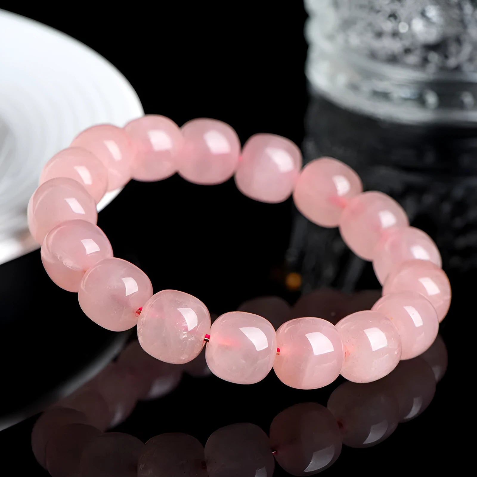 Pink barrel-shaped crystal bead bracelet with polished finish and original geometry design