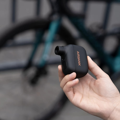 Black AS100 electric bicycle tyre pump with USB charging cable and waterproof bag