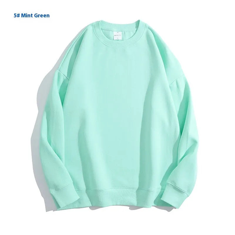 Women's loose fit cotton off shoulder sweater in a solid colour on a hanger.