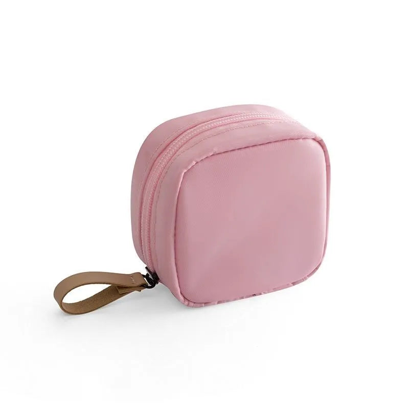 Blue cloth makeup storage bag with cube shape and plain pattern for cosmetics organisation