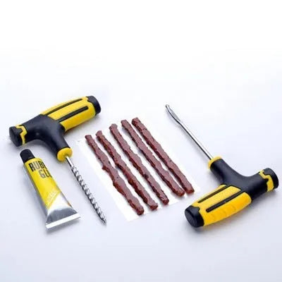 Black or yellow 8-piece vacuum tyre repair tool kit with rubber strips, glue, probe, and pin.