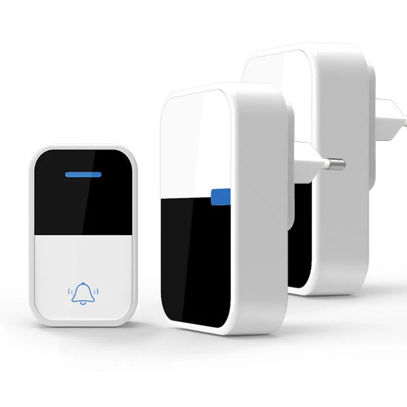 White plastic wireless doorbell receiver and self-generating button on a white background.