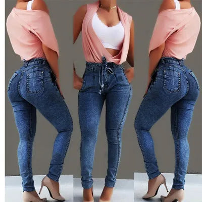 Pair of women's light blue straight-leg jeans with a frayed, distressed hem detail.
