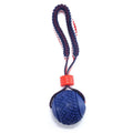 Natural rubber dog ball with rope toy in blue or red featuring textured surface for teeth cleaning