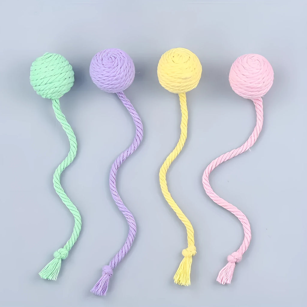 Green and pink soft plush cat toy balls with rope tails and internal bells