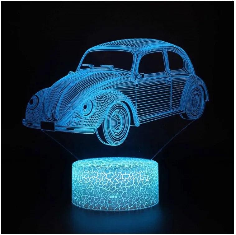 Small 3D LED table lamp with colourful acrylic shade and remote control on wooden desk