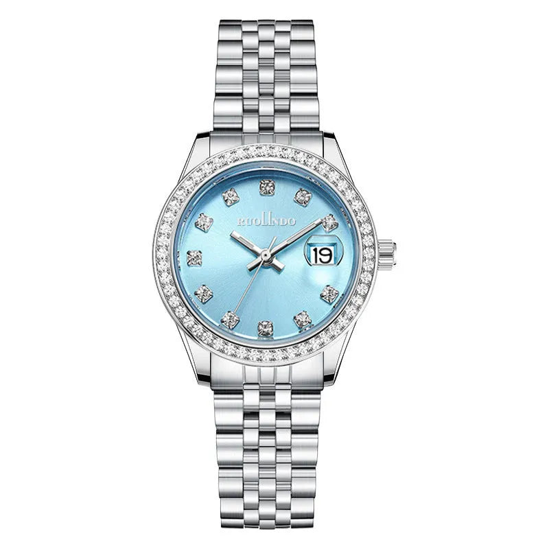Women's silver alloy fashion watch with circular dial and stainless steel buckle on wrist.