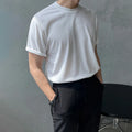 Cotton slim fit T-shirt with round neck and regular sleeves in solid colour