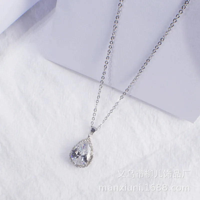 Rose gold plated drop pendant necklace with colourful rhinestones in a pink colour option.