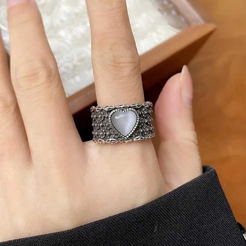 Retro wide-faced heart ring with adjustable opening in white copper plated silver