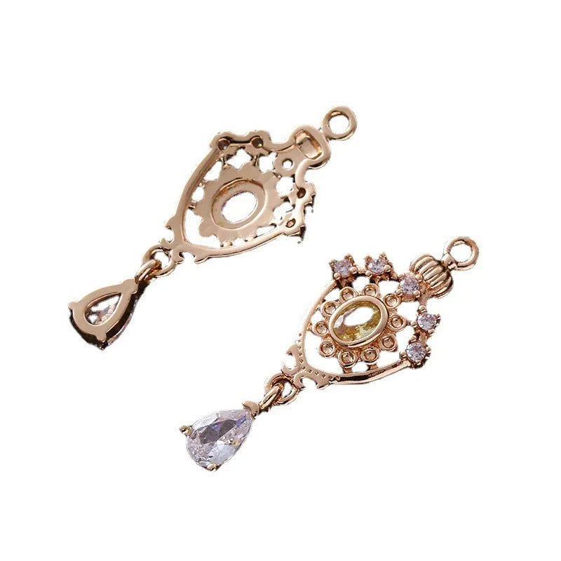 Hollow water drop shaped pendant with micro inlaid zircon on a crown outline in five colour options.