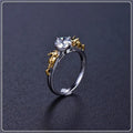 Copper crown modelling cosplay ring in a black gold finish on a hand.
