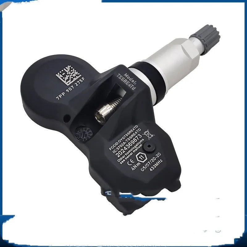 Black tyre pressure monitoring sensor for Audi vehicles on white background