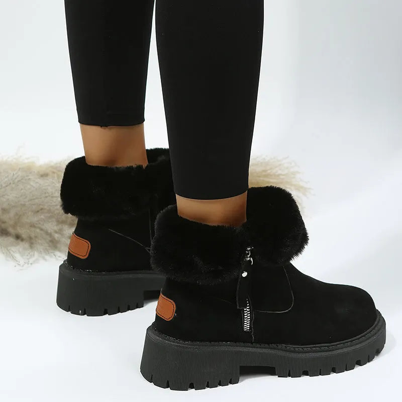 Black women's high-top snow boots with side zipper, faux suede upper, and non-slip rubber sole.