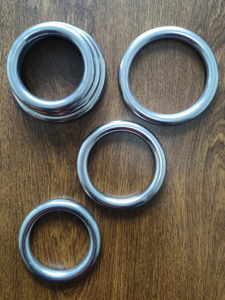 Wing Chun carbon steel training ring in three sizes for martial arts strength conditioning.