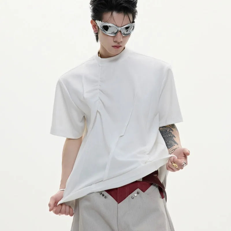 Men's grey cotton T-shirt with loose fit, round neck, short sleeves, and textured three-dimensional pleats.