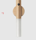 Compact smart sensor LED desk lamp made of solid wood and organic glass in coffee colour.