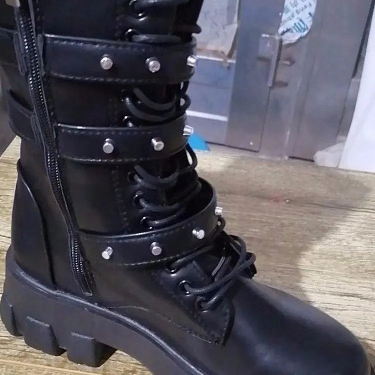 Women's black mid-calf knight boots with side zipper and metal belt buckle on artificial PU upper.