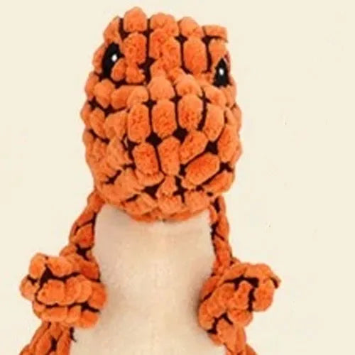Grey, green, and orange coloured dog chew toy with sound, shown with size scale.