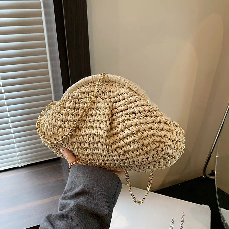 Shell-shaped women's straw bag with chain strap in khaki colour option showing zippered pocket detail