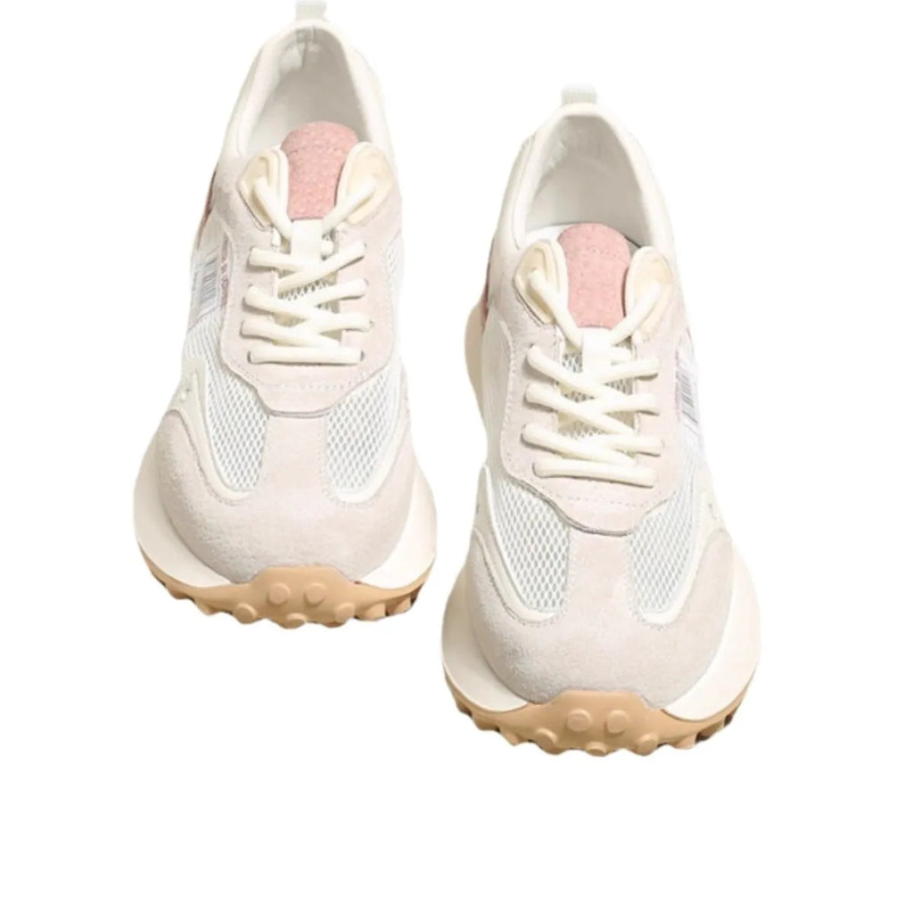 Women's grey retro sneaker with low-top design, mesh lining, and rubber sole
