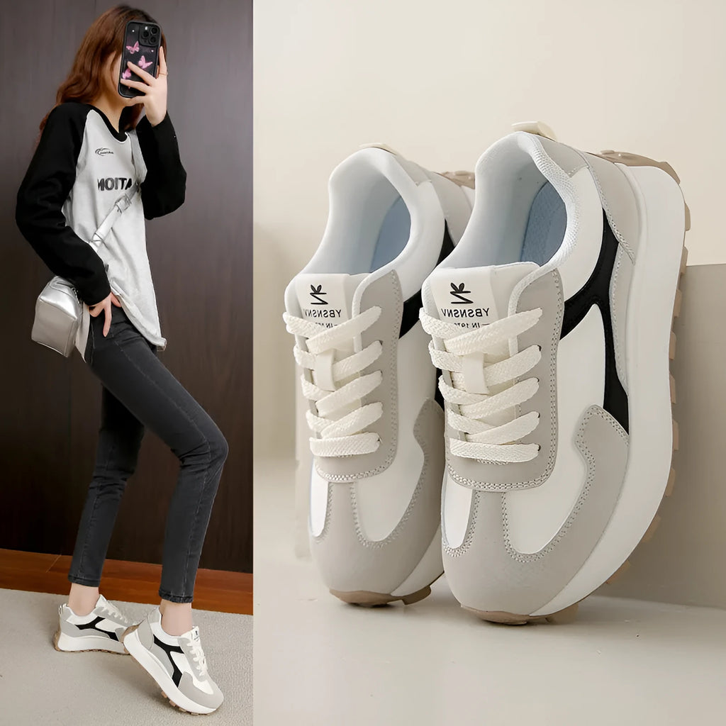 Women's low-top sports running shoes with mesh lining and front lace-up closure in solid colour options