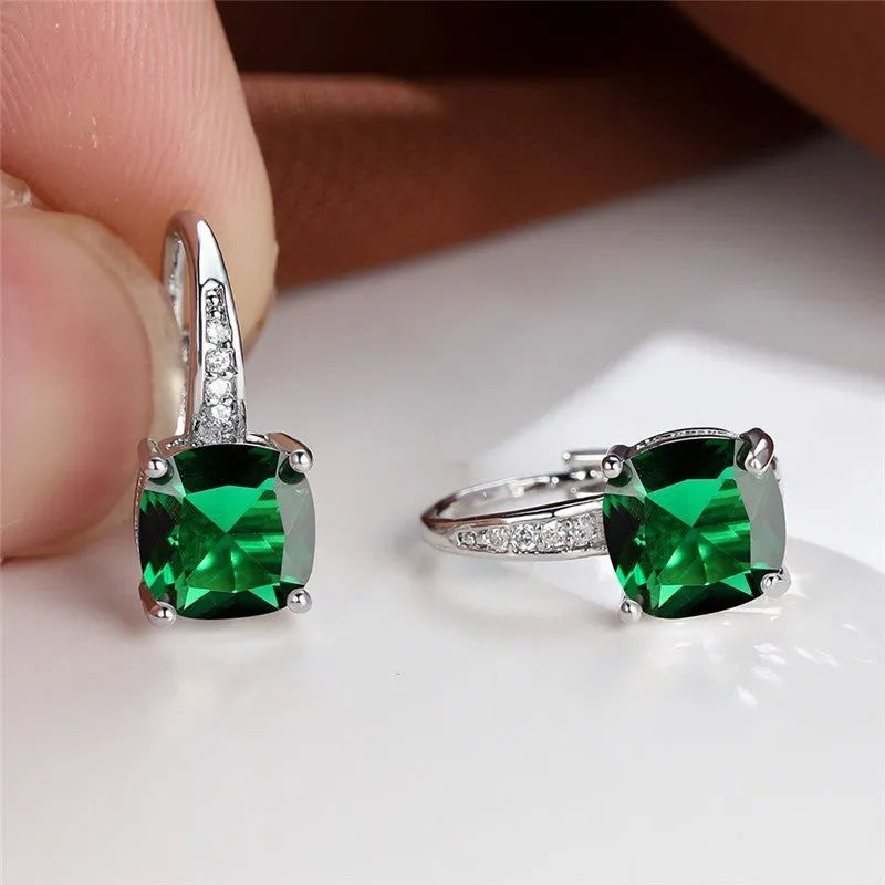 Square geometric ear hook earrings with zircon stones in an electroplated copper setting.