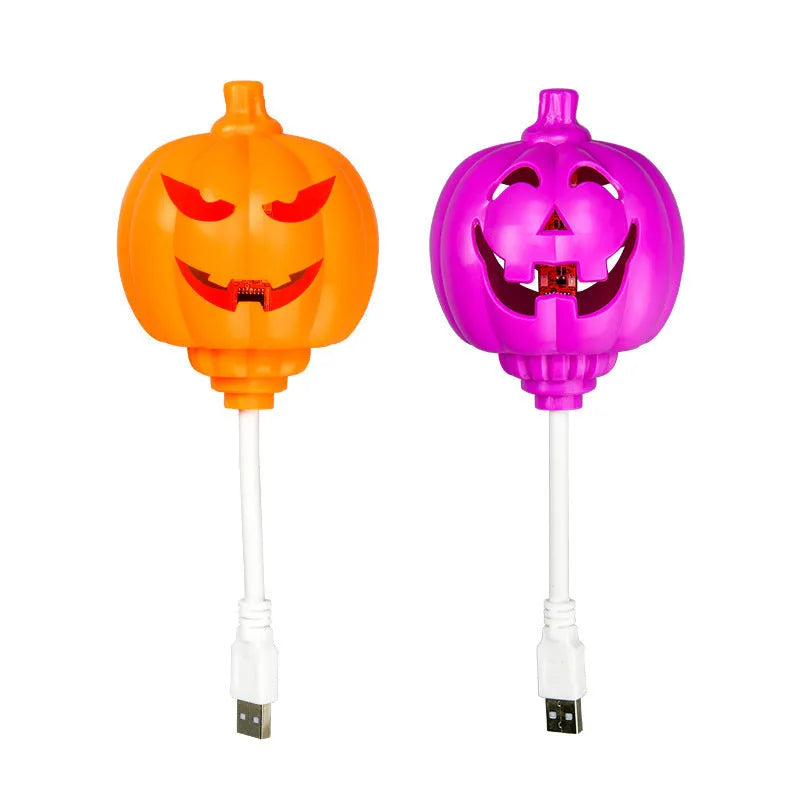 Plastic pumpkin-shaped lamp with USB charging cable, showing purple light option.