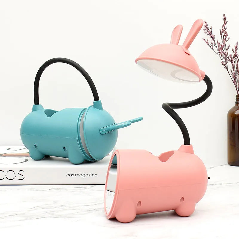 Cartoon-style USB desk lamp with integrated pen container in modern simplicity design